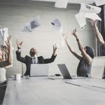 business team throwing paper when meeting success with happy emotion together, people with successful concept,